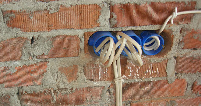 installation of a socket into a brick wall